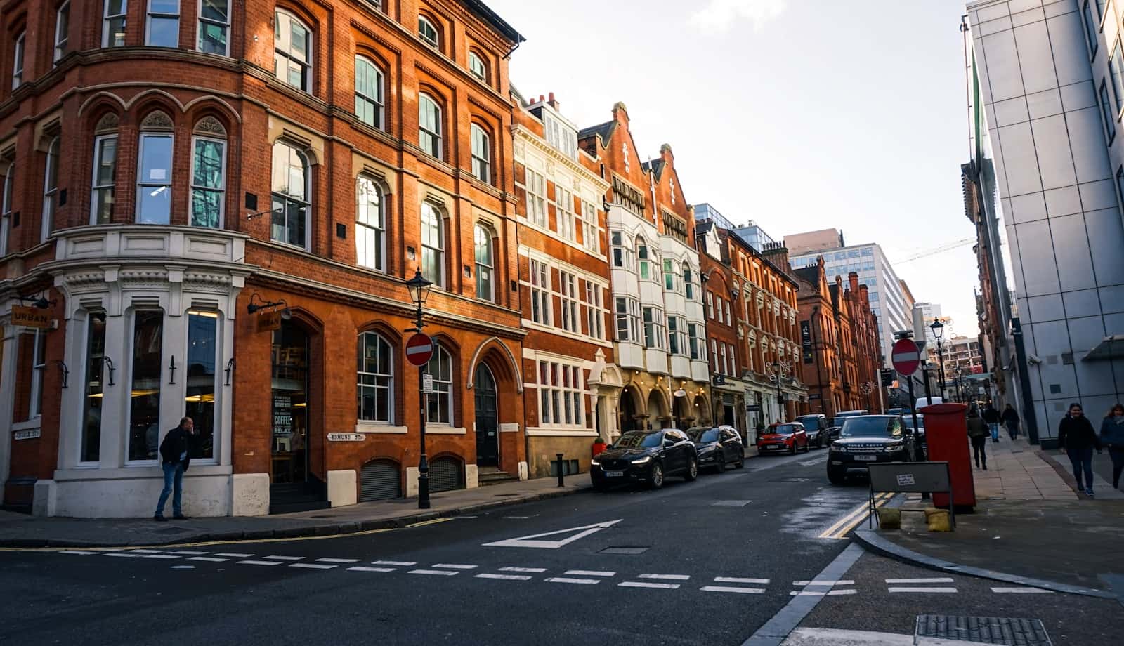 Cars parked outside a brick building in Birmingham