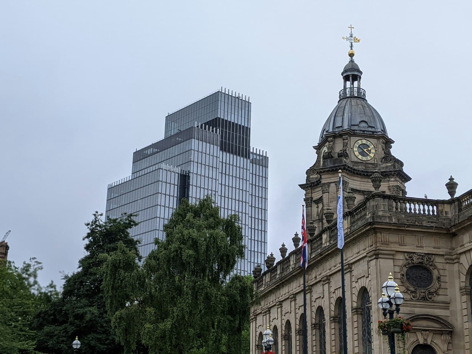 A Birmingham building beside green trees